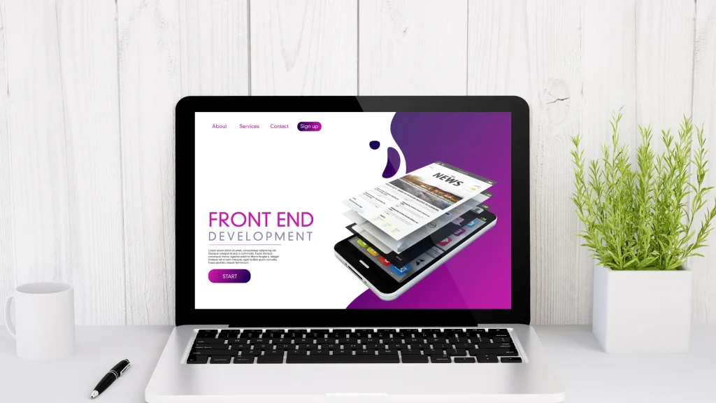 A laptop displaying a front-end development website with a modern design showcasing multiple screens and mobile integration.